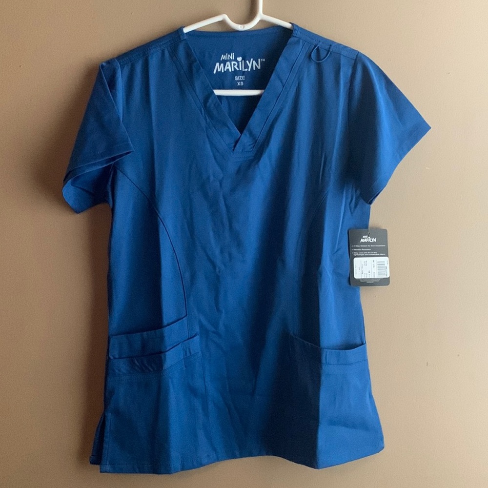 Brand new scrub set in royal blue.